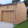 Porte de garage basculante en bois assortie à la façade