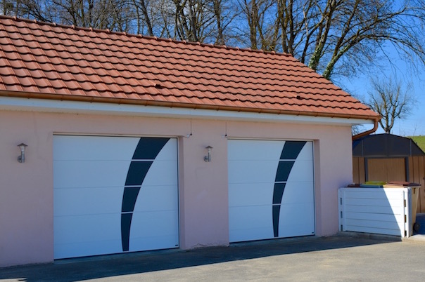 White sectional garage door with steel decorations